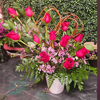 Dozen roses with curly willow shaped as a heart